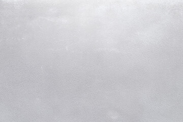 Plastered concrete or stone wall painted in white, front view. High resolution full frame textured background. Copy space.