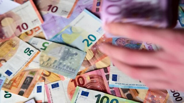closeup female hands count paper 500 euro banknotes of european union, paper banknotes on table, concept of cash, payments, savings, banking, save up for vacation, car, winnings in a casino