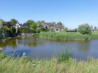 Picturesque landscape of waterways and greenery in Tuitjenhorn, North Holland, The Netherlands