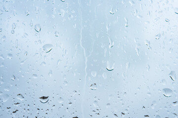 Wet rain drops on window glass season mood natural