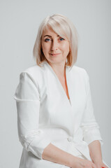 a woman in a white business suit on a white background
