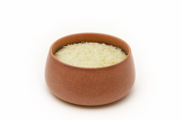 White steamed rice in a clay bowl. Close-up