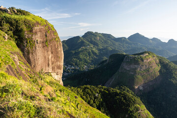 Fototapeta premium Beautiful view from rocky mountain top to green rainforest
