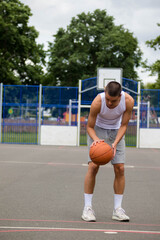 Fototapeta na wymiar A Nineteen Year Old Teenage Boy Playing Basketball