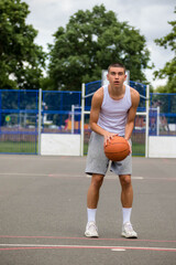 Obraz premium A Nineteen Year Old Teenage Boy Playing Basketball