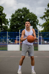 A Nineteen Year Old Teenage Boy Playing Basketball