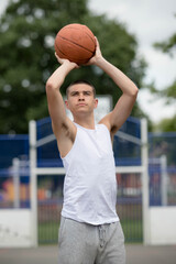 Naklejka premium A Nineteen Year Old Teenage Boy Playing Basketball