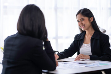 Analysis, Discussion, Asian women economists and marketers use a tablet computers to plan investments and finances to prevent risks and losses for the company, Negotiation
