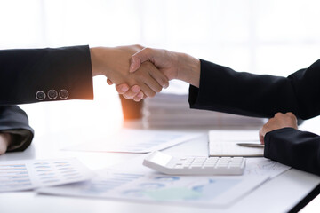 crop shot of business woman handshake collaborates with partners to increase their business investment network for Plans to improve quality next month in their office. agreement concept.