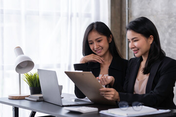 Analysis, Discussion, Asian women economists and marketers use a tablet computers to plan investments and finances to prevent risks and losses for the company, Negotiation