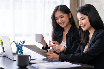 Analysis, Discussion, Asian women economists and marketers use a tablet computers to plan investments and finances to prevent risks and losses for the company, Negotiation