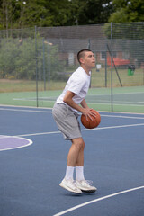 Obraz premium A Nineteen Year Old Teenage Boy Playing Basketball