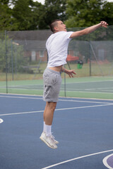 Obraz premium A Nineteen Year Old Teenage Boy Playing Basketball