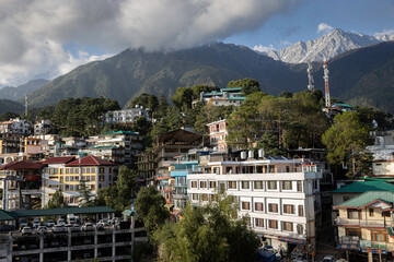 Part of the town Dharamshala with a high peak in the background, India