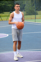 Obraz premium A Nineteen Year Old Teenage Boy Playing Basketball