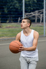 Fototapeta premium A Nineteen Year Old Teenage Boy Playing Basketball