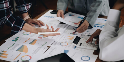 Meeting concept Business team hands at working with financial plan, meeting, discussion, brainstorm with tablet on the office desk,