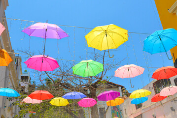Fototapeta na wymiar Hanging Colorful Umbrellas on a Puerta Vallarta Street in Mexico