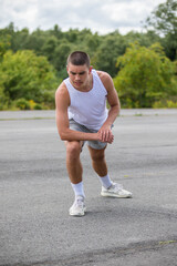 A Nineteen Year Old Teenage Boy Stretching In A Public Park