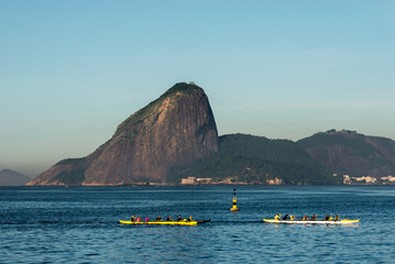 Two Rowing Boats in Guanabara Bay in Rio de Janeiro With the Sugarloaf Mountain in the Horizon