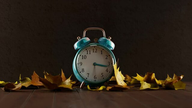Blue alarm clock with leaves changing from autumn to green