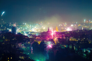Obraz na płótnie Canvas Colorful fireworks over the city at night