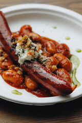 Sausage in cannellini bean sauce