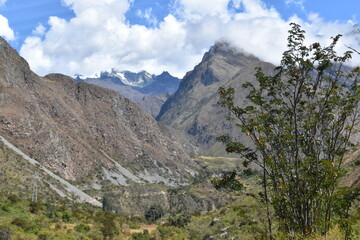 The dramatic landscapes of the Andes Mountains and cloud forests around the hiking path on the Inca Trail in Peru