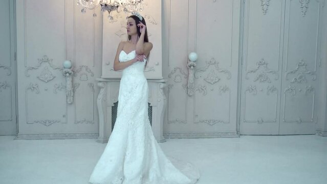 Slow Motion bride in a photo studio, a girl in a wedding dress
