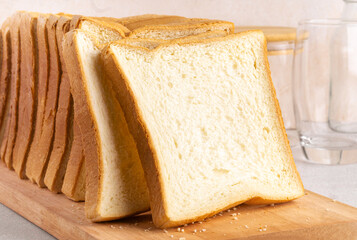 Stack of slice bread isolated on bright background. Close up.