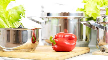 new pots and fresh vegetables in the new kitchen, modern home cooking with healthy food