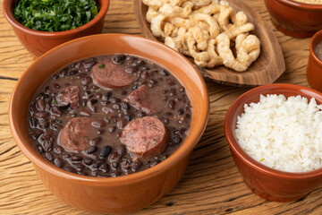 Typical brazilian feijoada with kale, rice and cracklings