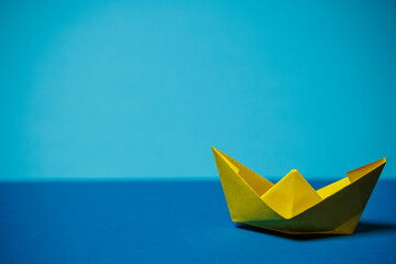 yellow boat on blue
