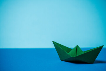 paper boat on water background