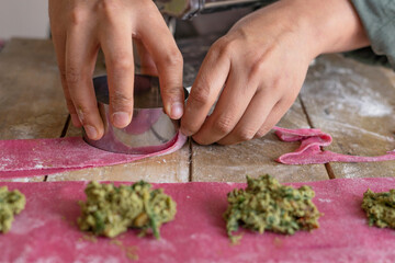 person cutting vegetables in the kitchen