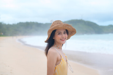 Young Beautiful woman in Bikini enjoying and relaxing on the beach,  Summer, vacation, holidays, Lifestyles concept.