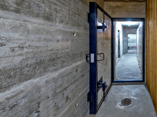 armored door of a public nuclear fallout shelter in an apartment building in Switzerland