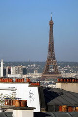 View from Montmartre to the rooftops of Paris, red chimneys and the Eiffel Tower