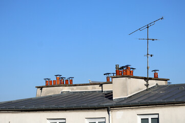 Close-up of chimneys on the rooftops of Paris