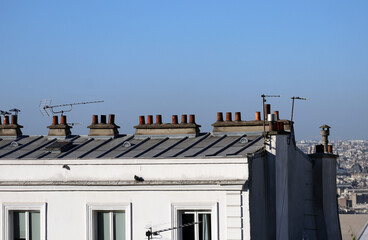Close-up of chimneys on the rooftops of Paris