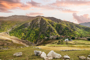 wide nature landscape of Pakistani village homes on a hill in mountains of Astore Valley Pakistan - obrazy, fototapety, plakaty