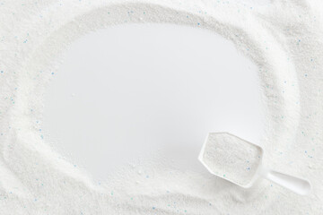 White washing powder with measuring cup. Laundry day concept
