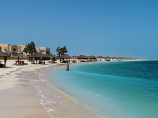 beach with umbrellas and chairs
