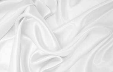 Obraz premium Smooth elegant white silk or satin luxury cloth texture as wedding background. Luxurious background design
