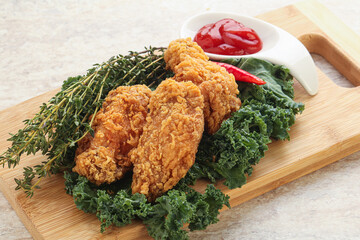 Crispy chicken wings with tomato ketchup