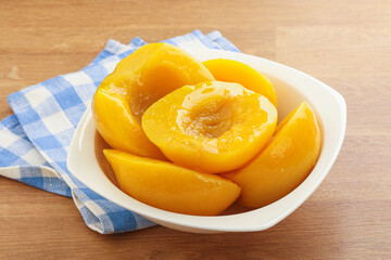 Sweet canned peaches with syrope