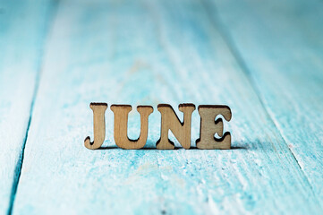 The month of June is large on a blue background. Calendar months. The names of the months for the calendar.