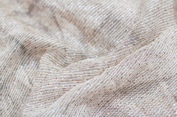 Natural Gauze fabric. Wrinkled gray fabric background. Closeup