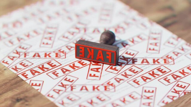 Wooden stamp with multiple red texts FAKE stamped on the document. False papers.