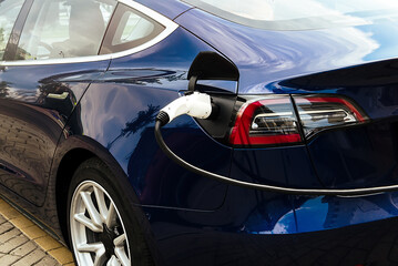 Electric car at the charging station. Ecology. Eco-friendly transport